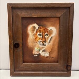 Vintage photo of lion or tiger holding a daisy framed and signed